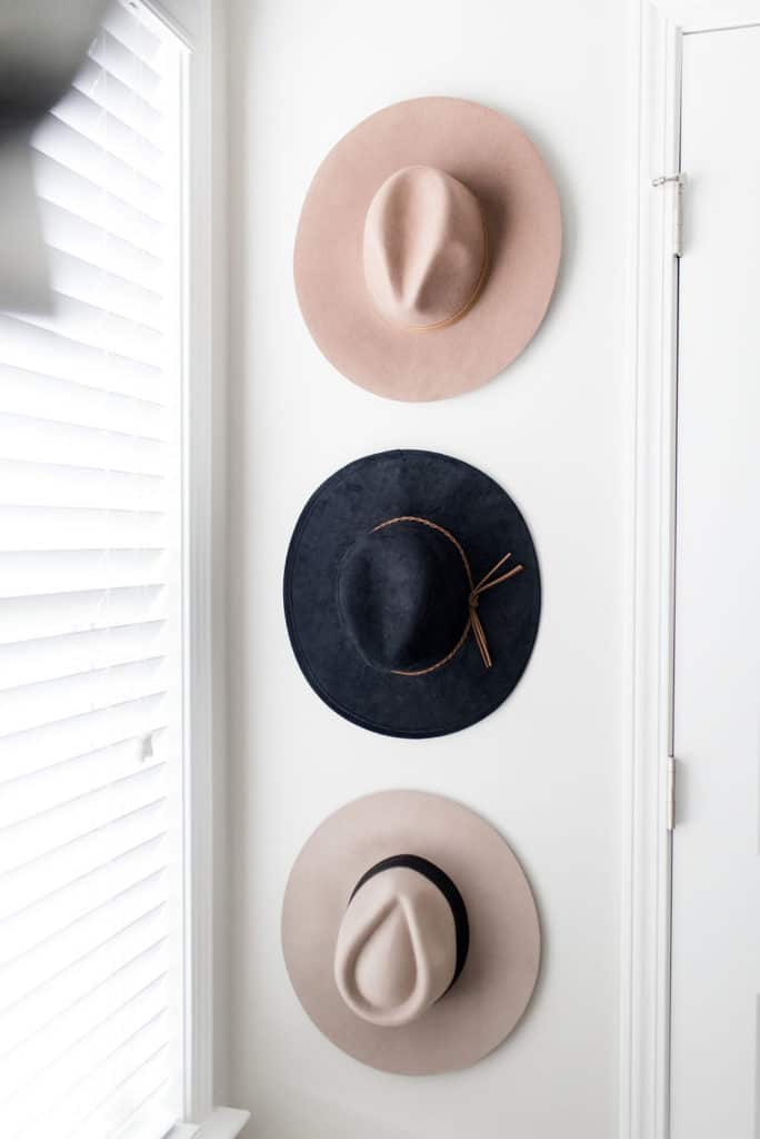 california closets custom walk in hats hanging on wall