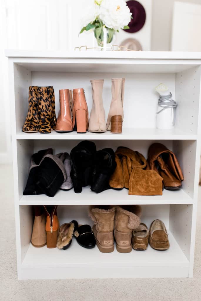 california closets custom walk in center console with shoe storage