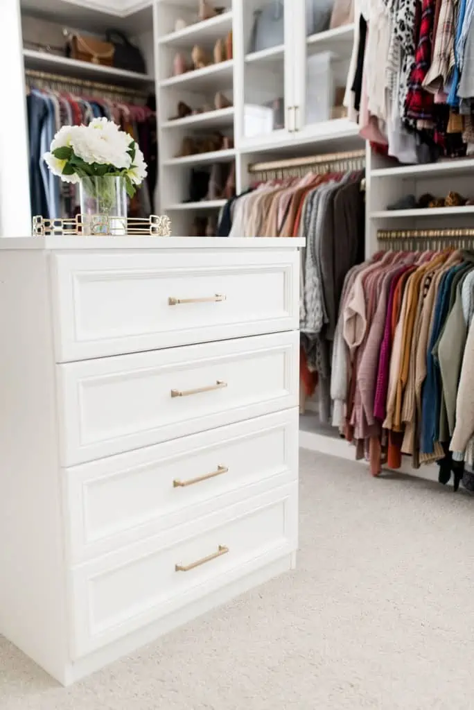 california closets custom walk in closet white drawers gold hardware
