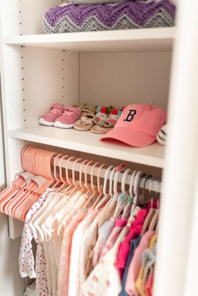 baby shoes and accessories on shelf of california closets baby nursery