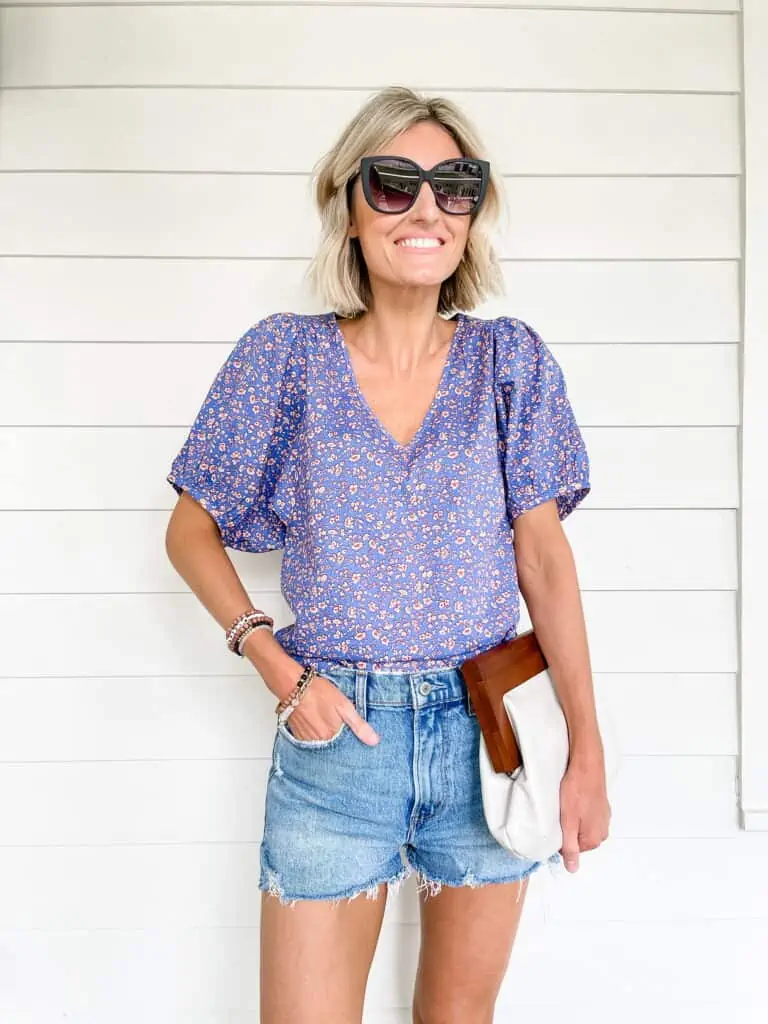 denim shorts and floral blouse